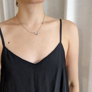 Paper airplane and star necklace